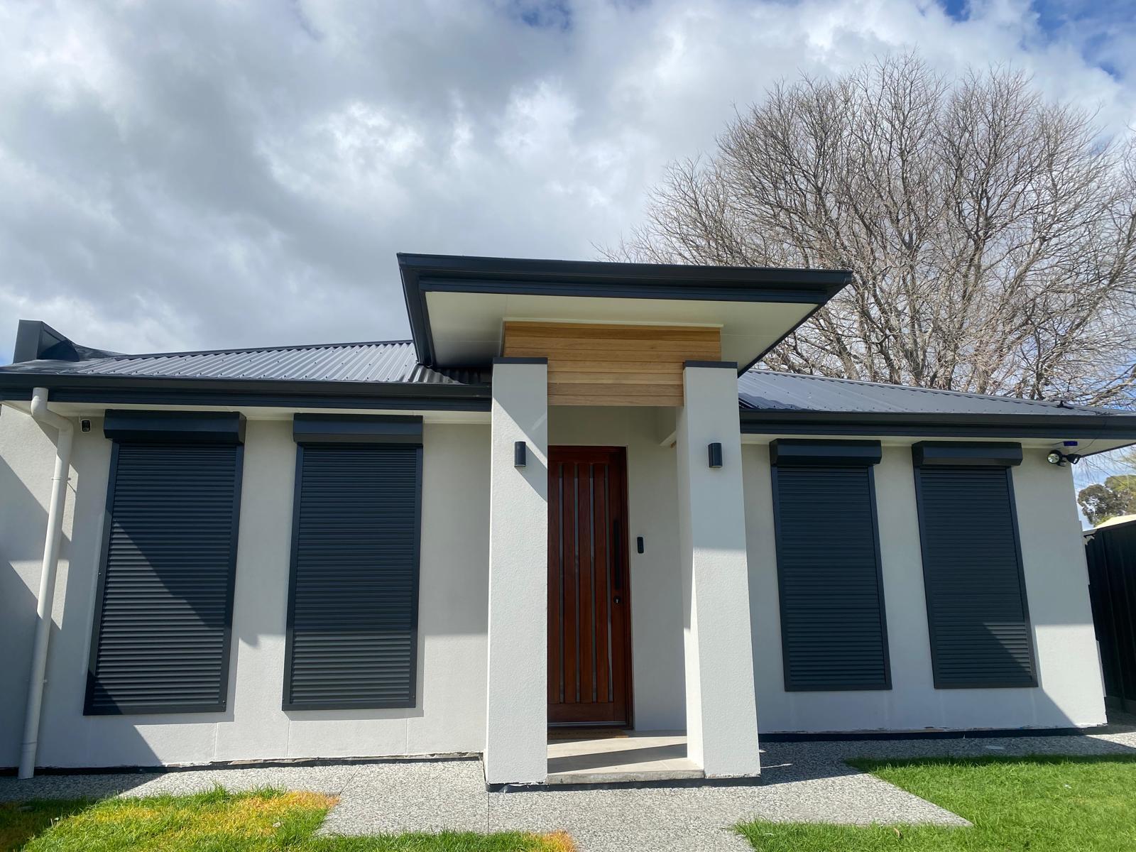 Worker Finishing Pergola Installation
